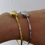 Bracciale rigido cuore bombato
